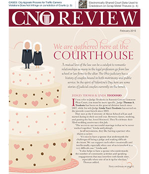 Image of multi-tiered wedding cake decorated with hearts and a male and female judge cake topper Image of multi-tiered wedding cake decorated with hearts and a male and female judge cake topper