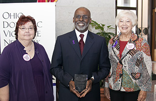 Image of Ohio Domestic Violence Network Executive Director Nancy Neylon, Cleveland Municipal Court Judge Ronald Adrine, and Elsa Croucher