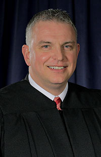 Image of Shane Leuthold wearing a black judicial robe Image of Shane Leuthold wearing a black judicial robe