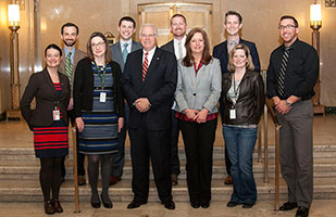 Image of retiring executive director of the Ohio Judicial Conference, Mark Schweikert, and other Judicial Conference staff.