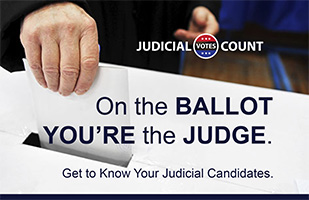 Image of a hand depositing a paper ballot into a box with the words: 'On the Ballot You're the Judge.'