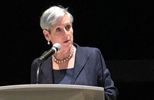 Image of Ohio Supreme Court Chief Justice Maureen O'Connor speaking from behind a podium