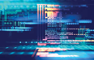 Image of computer programming code in front of a computer motherboard