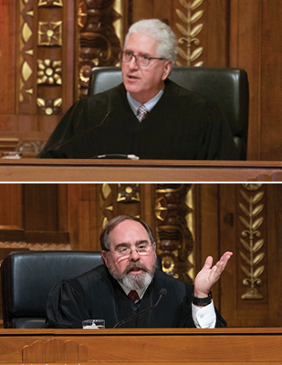 Image of two male judges engaged in oral arguments in the courtroom of the Thomas J. Moyer Ohio Judicial Center