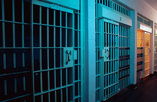 Image of a row of prison cells Image of a row of prison cells