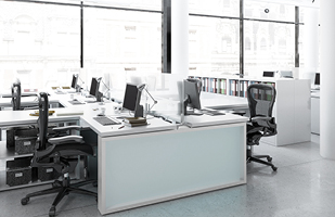 Image showing a group of desks lined up next to a wall of windows