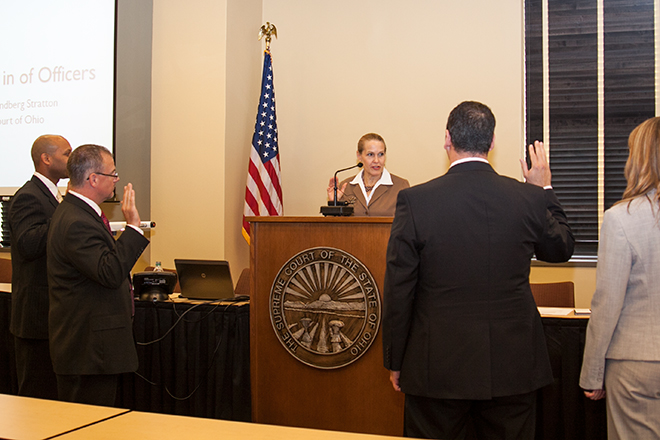 Ohio Supreme Court Justice Evelyn Lundberg Stratton administers the oath of office to the new officers of the Ohio Association for Court Administrators.