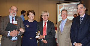 Recently retired OCLRE Executive Director Deborah DeHaan was presented with OCLRE's highest award, the Founders' Award, during the Law and Citizenship Conference. Pictured from left to right are OCLRE Board Secretary Thomas Friedman, DeHaan, OCLRE Board President Marion Smithberger, and OCLRE board members Richard Dove and Daniel Hilson.