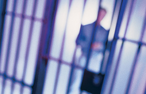 Image of an inmate behind bars