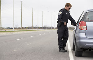Image of a police officer conducting a traffic stop