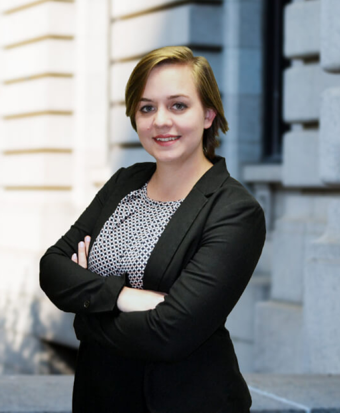 Image of a smiling woman wearing a black suit