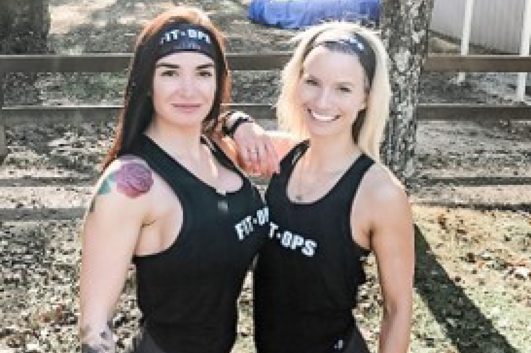 Image of two women wearing matching leggings and tank tops