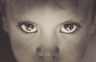 A close-up image of a child's sad face (NadiaCruzova/Getty Images)