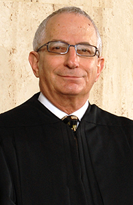 Image of Judge Jeffrey Froelich in his robe.