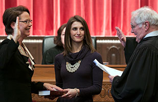 Ohio Supreme Court Justice Sharon L. Kennedy taking the oath of office from retired Butler County Common Pleas Court Judge Matthew Crehan