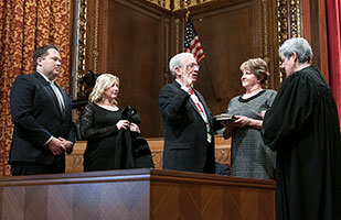 Image of Ohio Supreme Court Justice Patrick F. Fischer, Fischer's wife, Jane, their daughter and son-in-law, and Ohio Supreme Court Chief Justice Maureen O'Connor