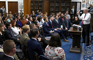 Image of Ohio Supreme Court Justice Patrick F. Fischer standing at a lecturn speaking to a group of men and women