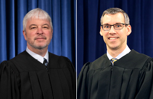 Image of two male judges wearing black judicial robes
