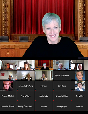 Picture of a video screen showing Chief Justice Maureen O'Connor and another video screen showing the names or photos of those in the virtual meeting