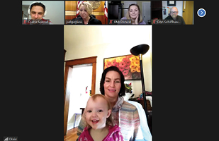 Image of a woman and a toddler participating in a video conference