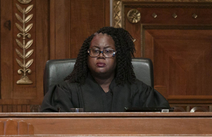 Image of a female judge participating in oral arguments in the courtroom of the Thomas J. Moyer Ohio Judicial Center