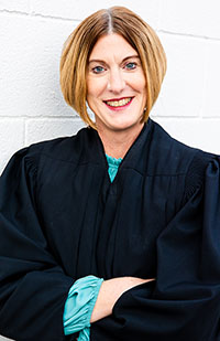 Image of a woman wearing a black judicial robe