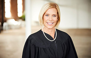 Image of a woman wearing a black judicial robe