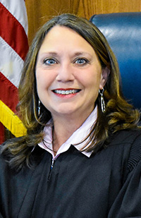 Image of a smiling female judge