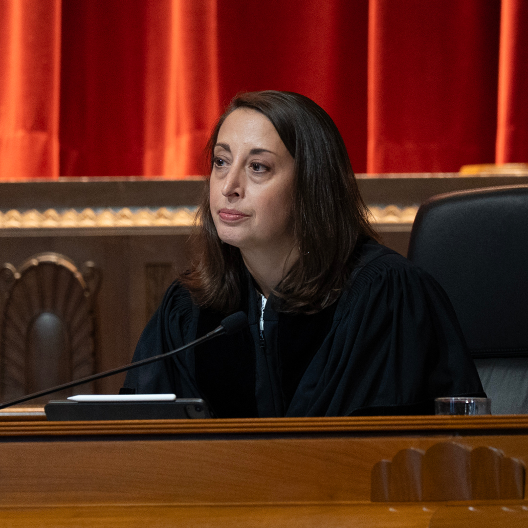 A woman judge sitting on the bench in the Thomas J. Moyer Ohio Judicial Center Courtroom