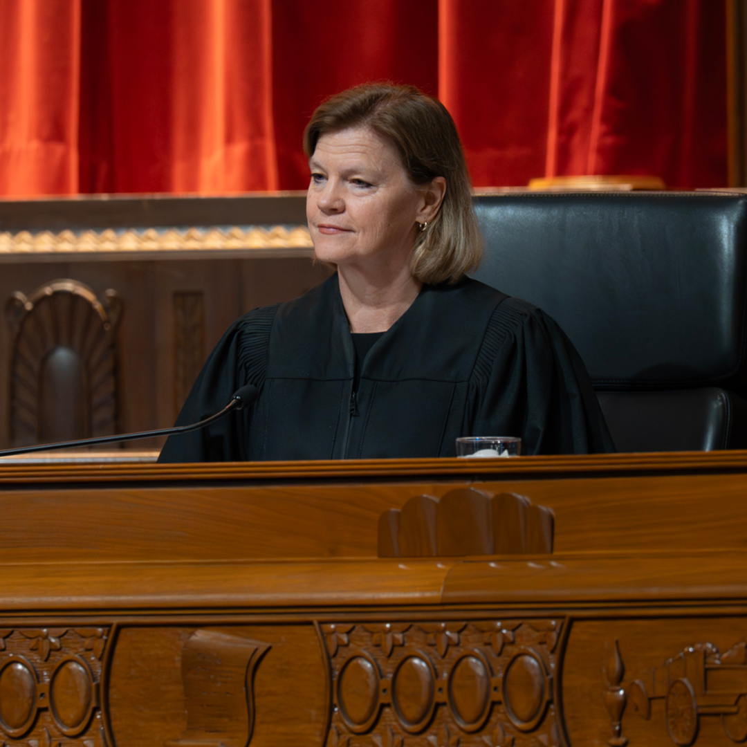 A woman judge in a judicial robe on the bench of the Thomas J Moyer Ohio Judicial Center