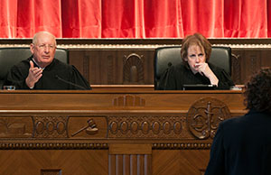 Image of Chief Justice Maureen O'Connor and Justice Paul E. Pfeiffer during oral arguments in the Supreme Court courtroom.
