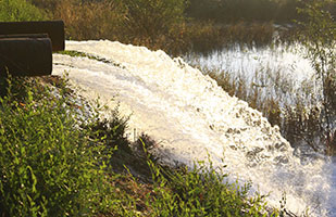 Image of water flowing from outdoor water pipes (Photo Credit: iStock)