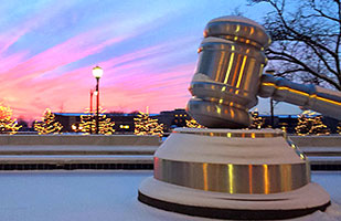 Image of a snow-covered giant gavel in the south plaza of the Thomas J. Moyer Ohio Judicial Center