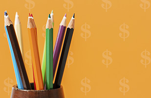 Image of a cup full of different colored pencils in front of a background of dollar signs