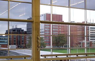 Image of the Ohio State University Wexner Medical Center as seen through a window at the university's Recreation & Physical Activity Center (RPAC)