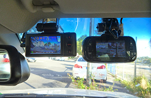 Image of a close up of a couple of dash cams in a police cruiser