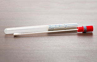 Image of a DNA swab and container (THINKSTOCK)