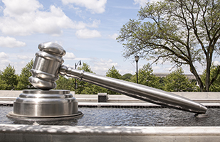 Image of the giant stainless steel gavel in the south plaza of the Thomas J. Moyer Ohio Judicial Center