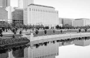 Black and white image of the outside of the Thomas J. Moyer Ohio Judicial Center as seen from across the Scioto River