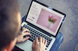 Image of a flower arrangement on a Web page displayed on a laptop computer
