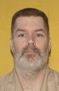 Image is a headshot of inmate George C. Brinkman