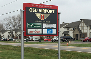 Image shows the neighborhood sign for the OSU Airport.