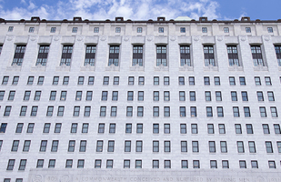 Image is of the white marble Thomas J. Moyer Ohio Judicial Center from the side looking up