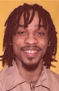 Image of a smiling prison inmate