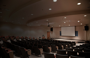 Image of an empty university lecture hall.