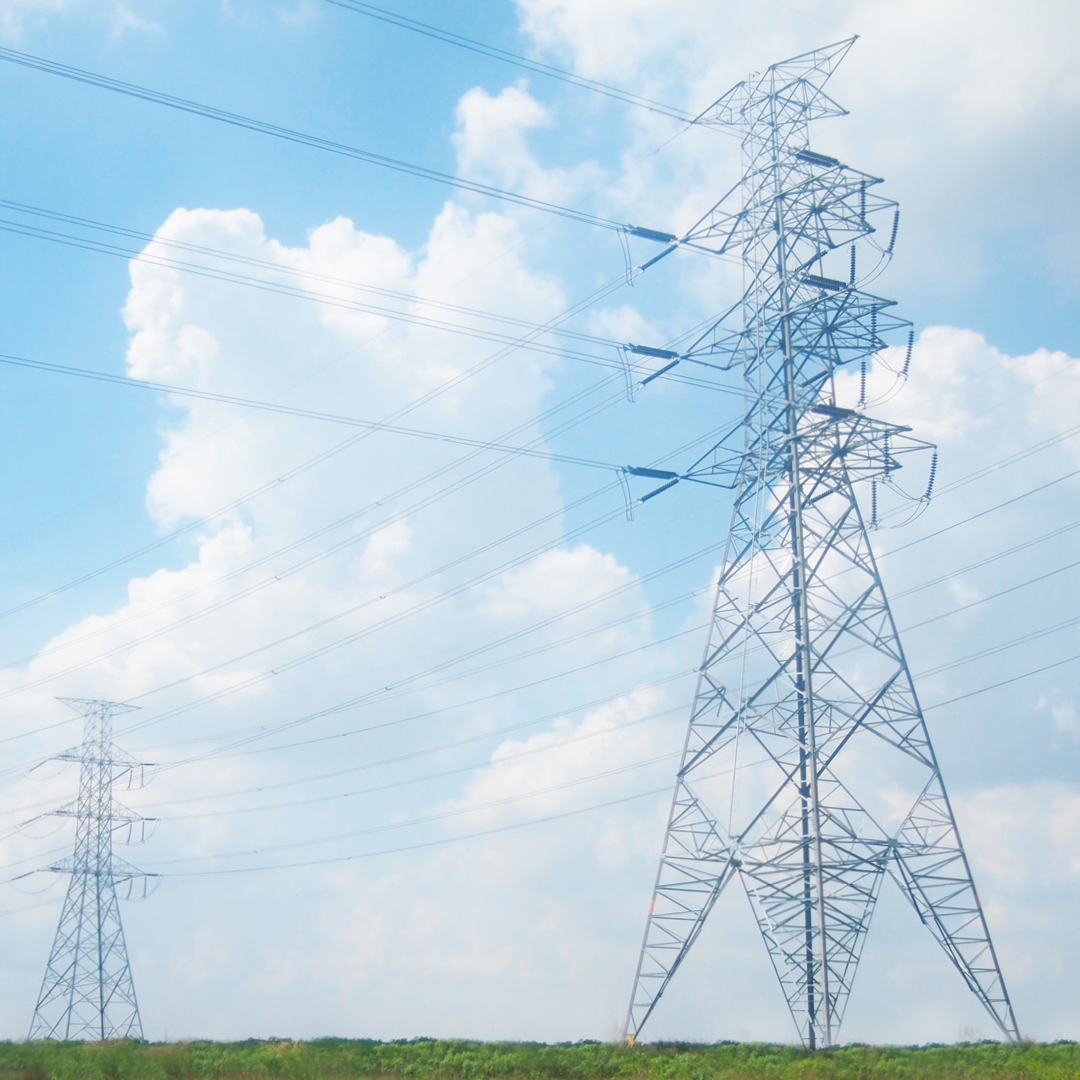 Power lines interconnected with transmission towers.
