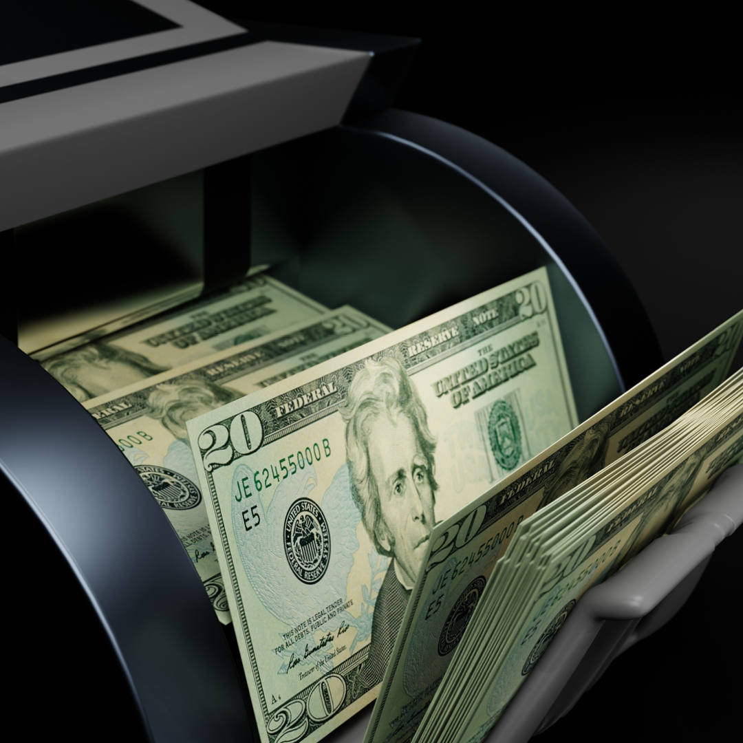 A money counting machine full of cash.