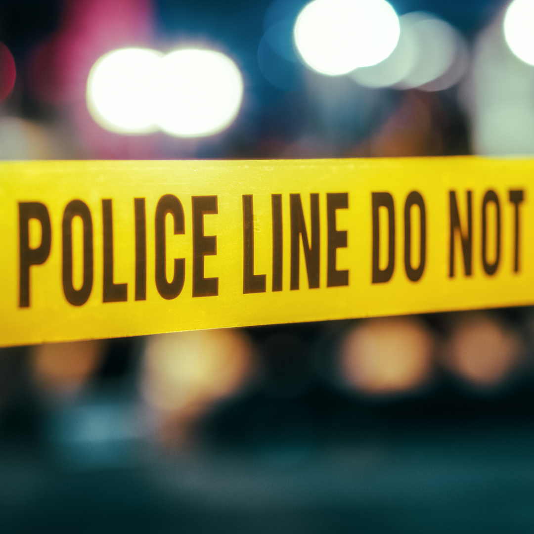 Crime scene tape reading 'Police Line Do Not Cross'