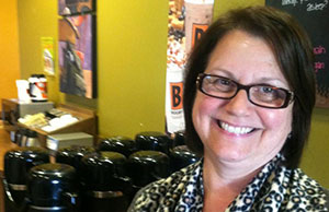 Sue Strausbaugh, newly appointed chair of the Advisory Committee on the Judicial Family Network, in her Defiance coffee shop.