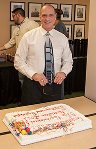 Colleagues delivered a sweet surprise to Dr. Frank Ezzo during an October 26 training session. Ezzo chose to lead the training rather than attend an awards ceremony where he was being honored.